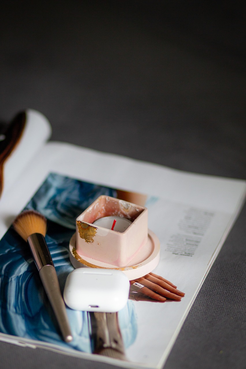 candle, magazine, cosmetic, brush, headphones